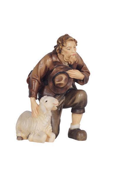 Hirt kniend mit Schaf